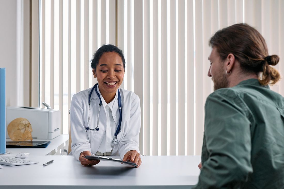 A doctor and patient in conversation during a consultation